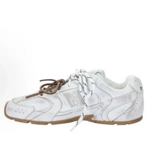 New Balance retro-style white canvas shoes