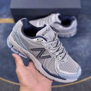 New Balance retro-style grey-blue sports shoes
