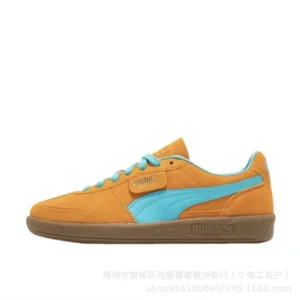 PUMA retro-style orange and blue sneakers.