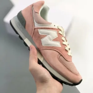 New Balance retro-style pink and grey sports shoes