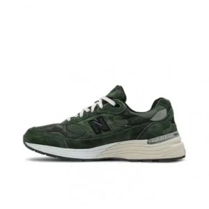 New Balance retro-style dark green running shoes