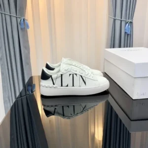 Valentino letter-style white sneakers.