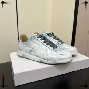 Maison Margiela's distressed grey-white shoes