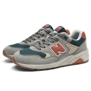 New Balance retro-style grey and orange sports shoes